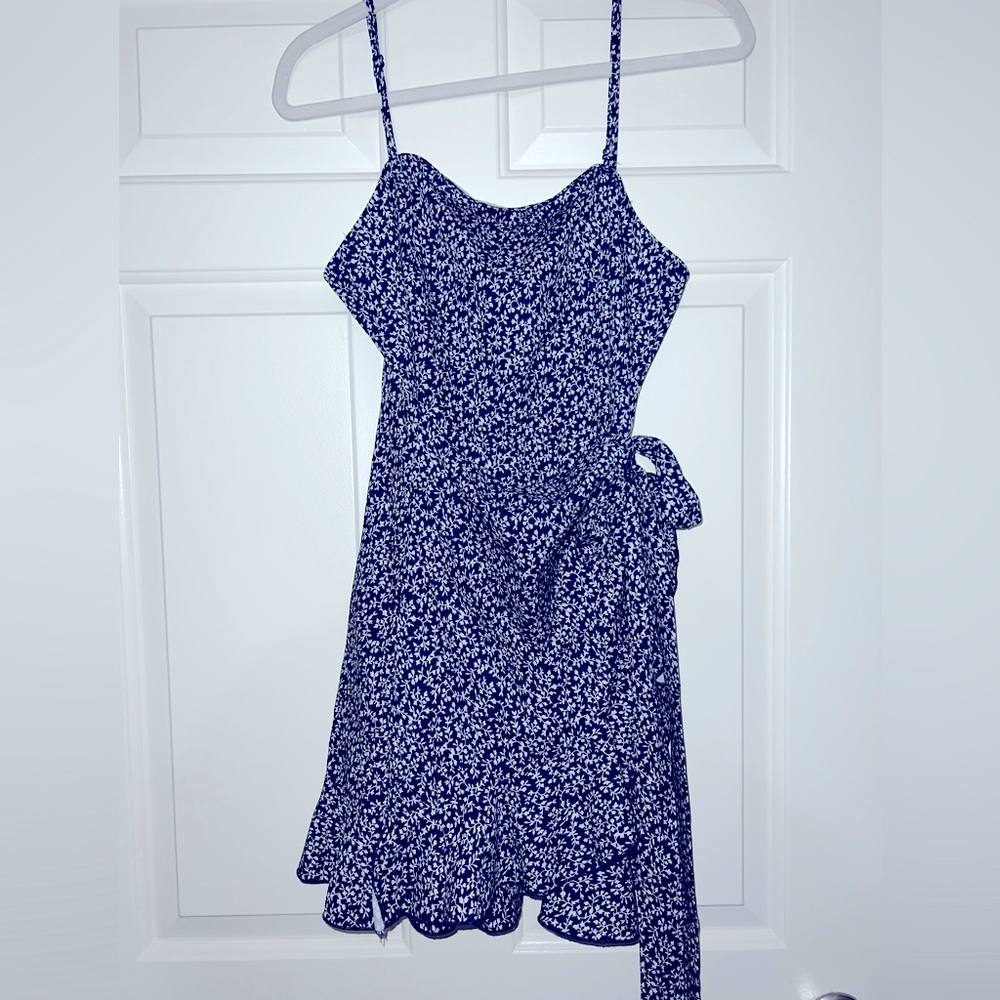 Blue floral pattern summer wrap dress.